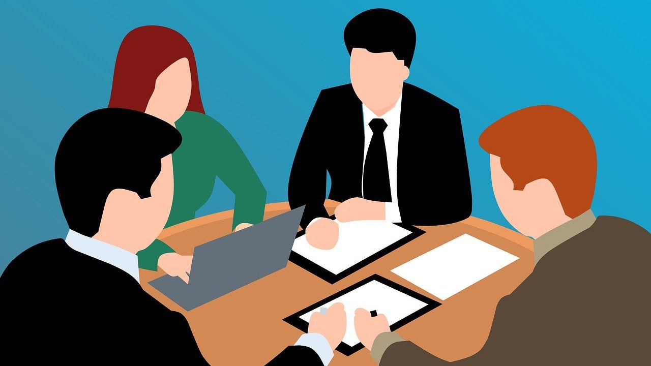 4 people discussing together